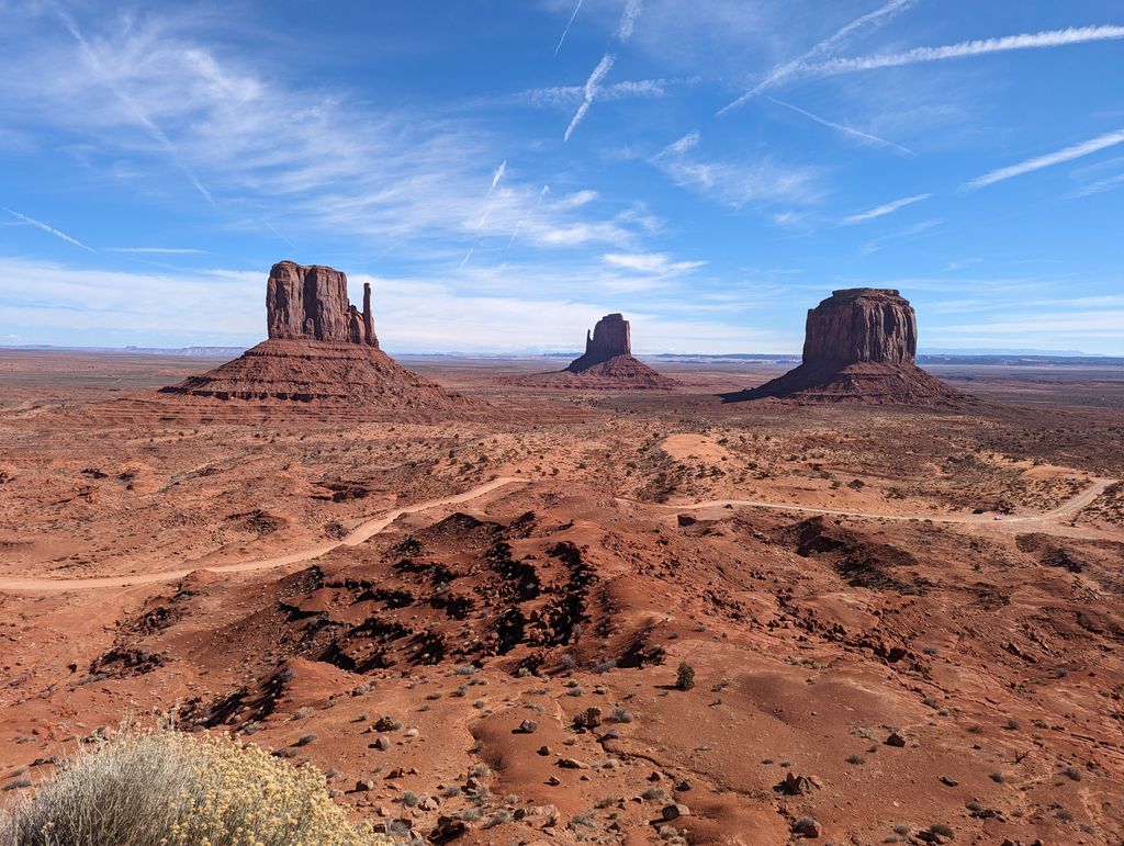 Breathtaking rock formations in Monument Valley under a clear blue sky.